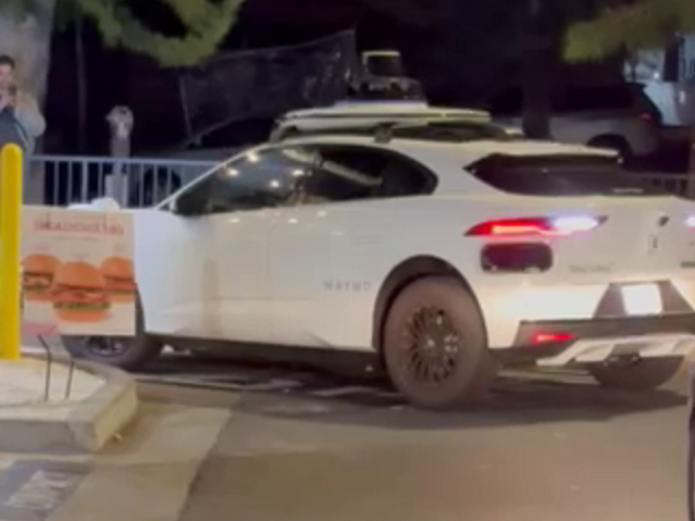A Waymo driverless taxi got stuck in a Chick-fil-A drive thru in Santa Monica on April 7, 2025. (Chris Kellogg)