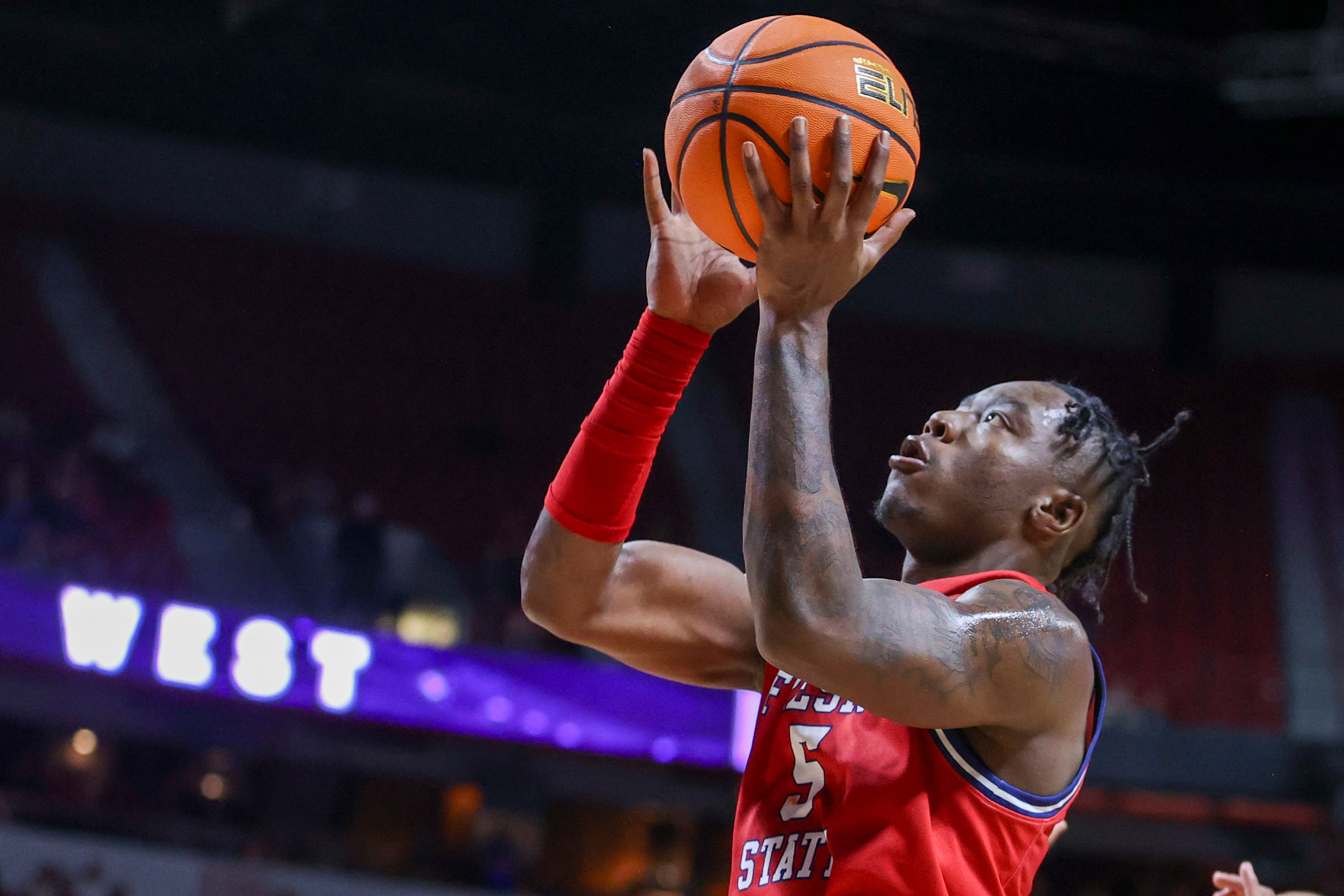 FILE - Fresno State guard Jalen Weaver (5) shoots over during the second half of an NCAA college basketball game against Utah State in the quarterfinal round of the Mountain West Conference tournament, Thursday, March 14, 2024, in Las Vegas. (AP Photo/Ian Maule, File)